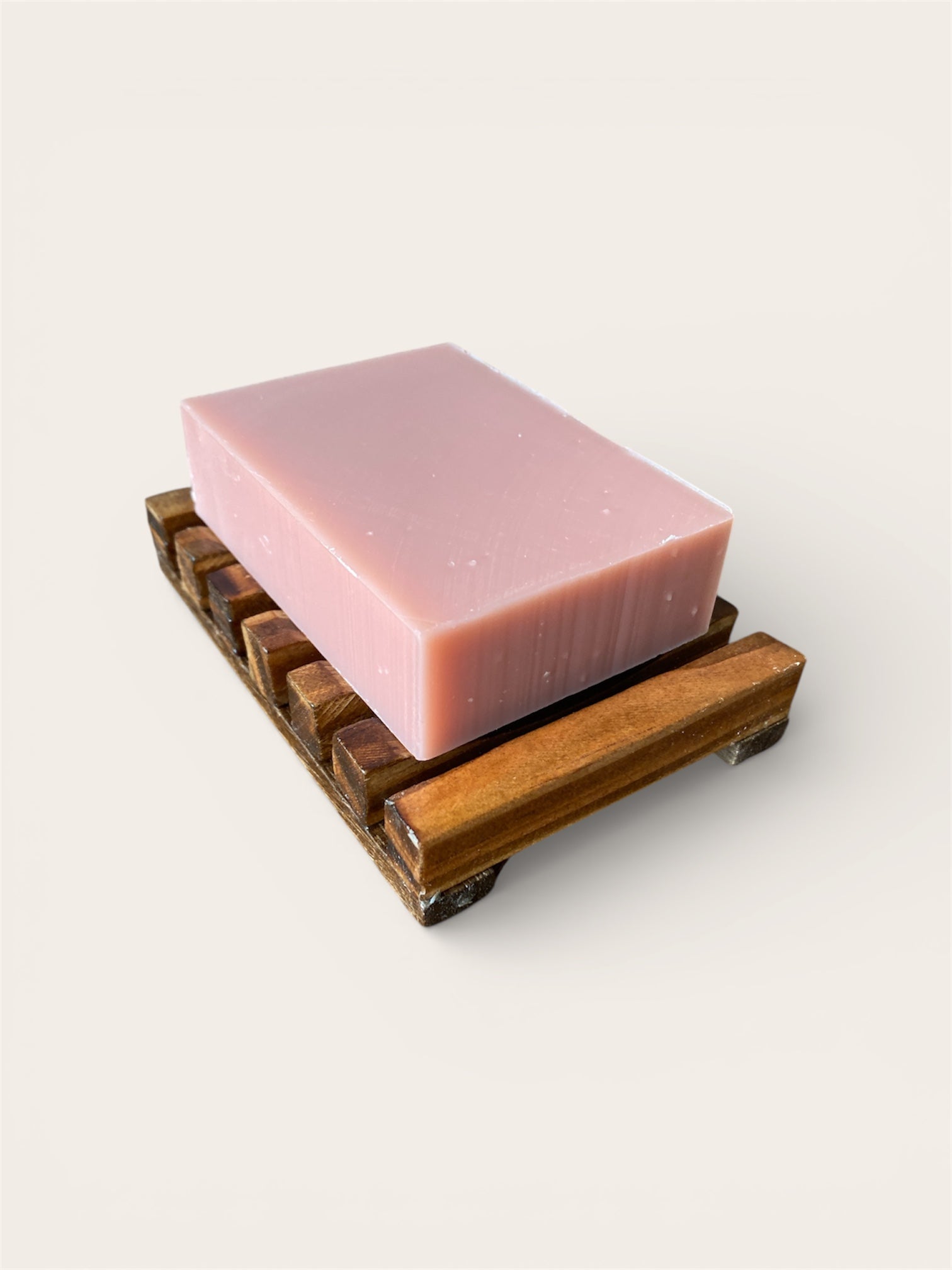 rose geranium soap on wood soap dish
