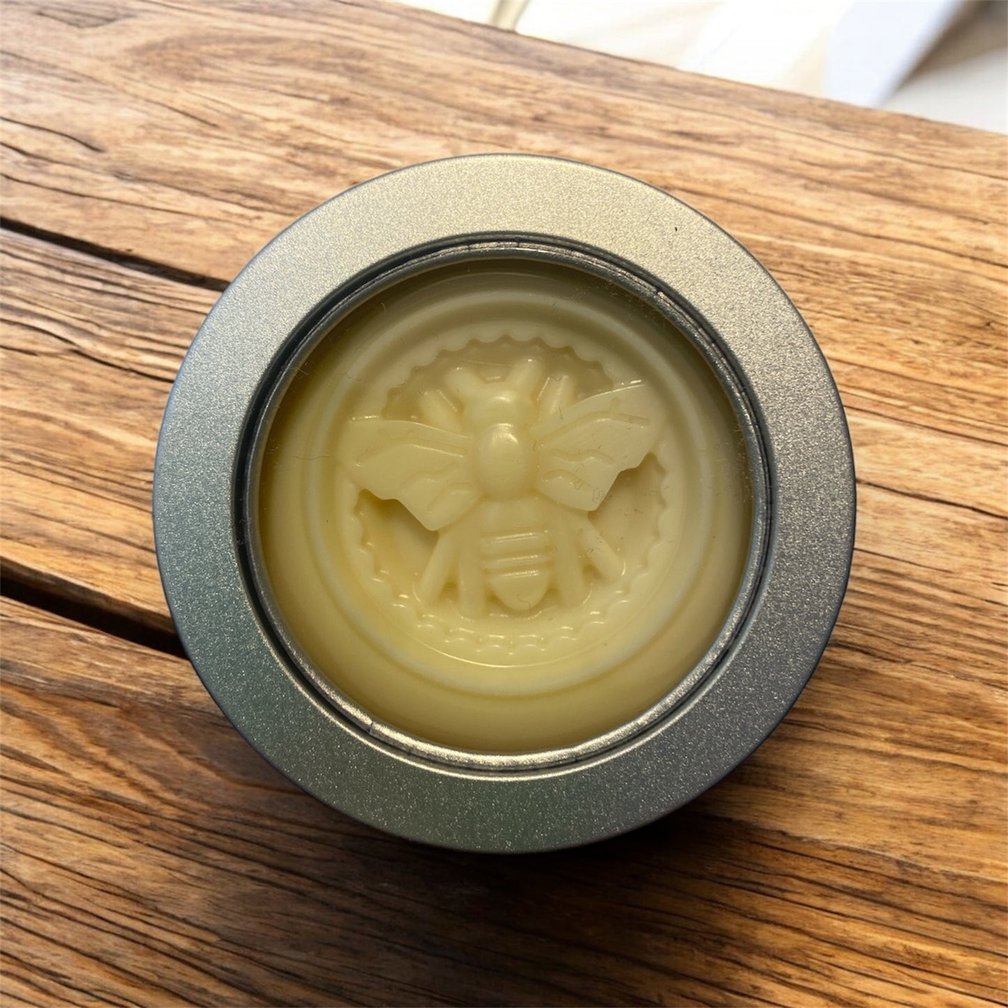 solid lotion bar on wood table